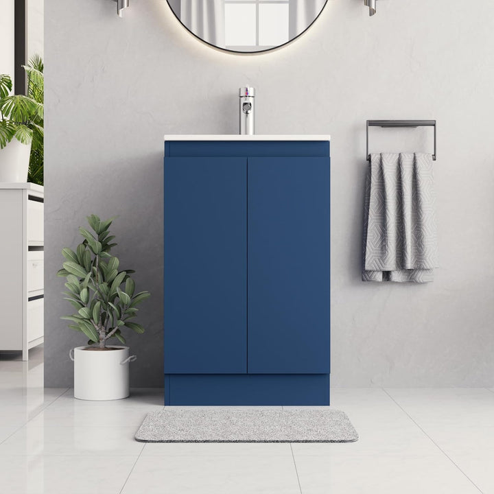 500mm dark blue vanity unit with white integrated sink and handleless design in modern bathroom