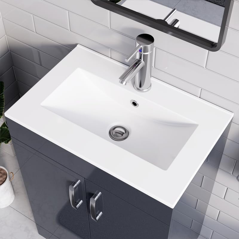 Close-up of white integrated sink with chrome faucet on 500mm grey gloss vanity unit