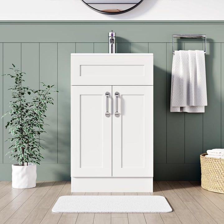 500mm matt white vanity unit with integrated sink and chrome handles in sage green bathroom