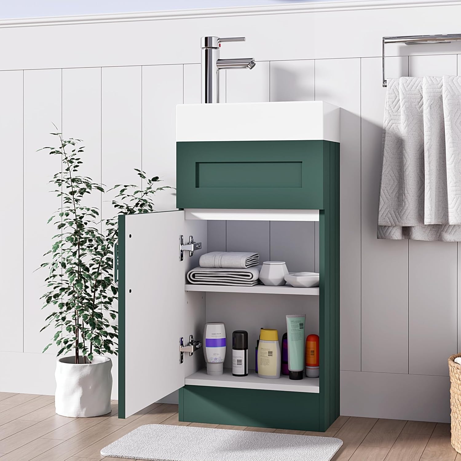 Dark green 400mm vanity unit with open cabinet door showing internal storage shelves and towels