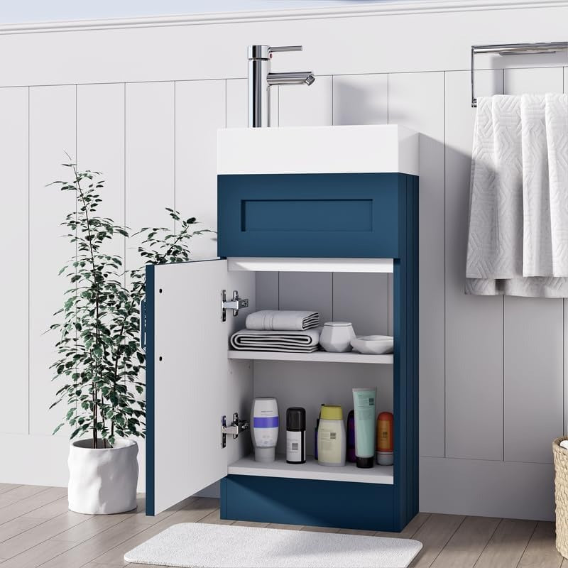 Navy blue 400mm vanity unit with open cabinet door showing internal storage shelves and towels