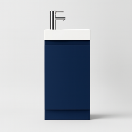 Blue vanity unit with white countertop and silver faucet on a light gray background