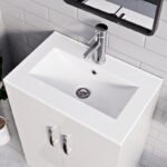 Close-up of white integrated sink with chrome faucet on 500mm new york white vanity unit