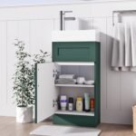 Dark green 400mm vanity unit with open cabinet door showing internal storage shelves and towels